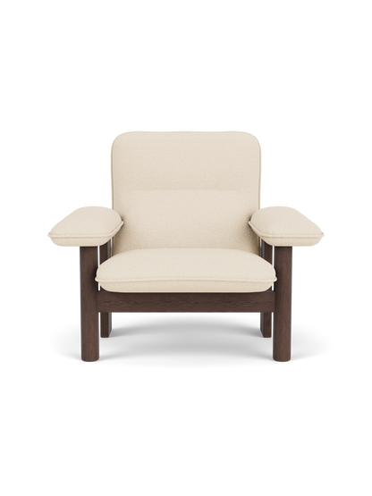 Front view of the Brasilia Lounge Chair, High Back, with a dark stained oak frame and cream-coloured Logan Jasmine fabric.