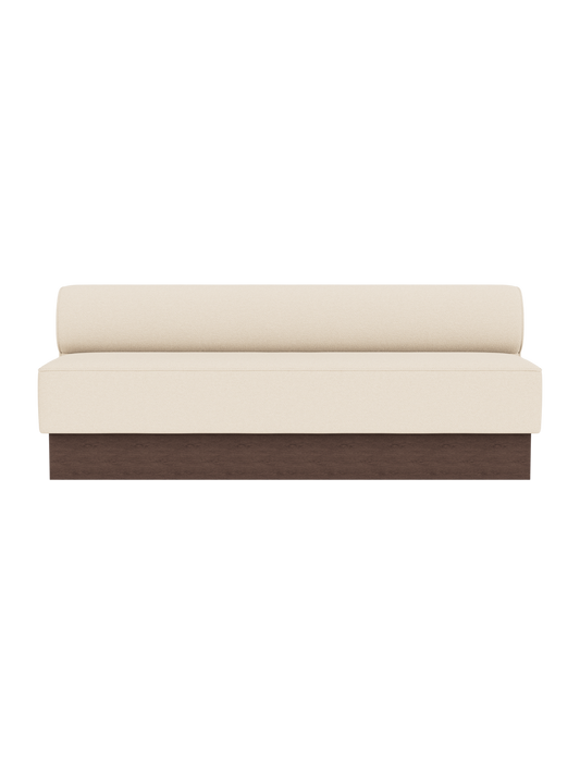 Eave Dining Sofa, Plateau upholstered in Logan Jasmine fabric with a dark stained oak base, shown from a front angle.