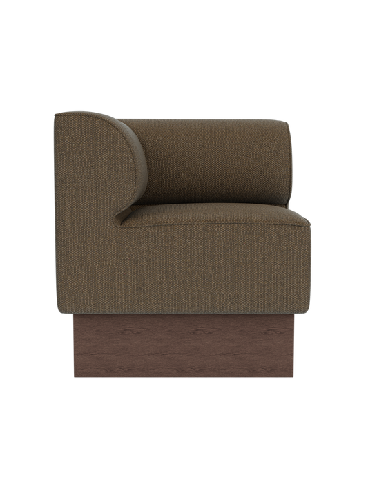 Eave Dining Sofa, Plateau corner module in Logan Nutmeg upholstery with a dark stained oak base, viewed from the side.