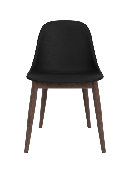 Harbour Side Dining Chair featuring a black Sierra leather shell and a dark stained oak wooden base.