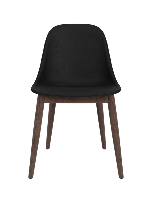 Harbour Side Dining Chair featuring a black Sierra leather shell and a dark stained oak wooden base.