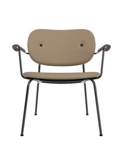 Co Lounge Chair upholstered in tan Sierra leather, featuring dark stained oak armrests and a black steel frame.
