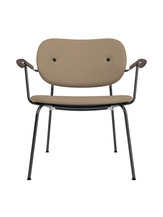 Co Lounge Chair upholstered in tan Sierra leather, featuring dark stained oak armrests and a black steel frame.