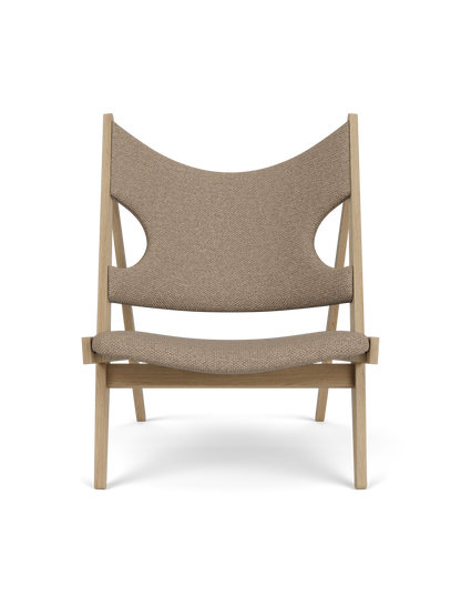 Front view of the Knitting Lounge Chair in Natural Oak. The chair has Logan Flint upholstery with distinctive elbow cut-outs.