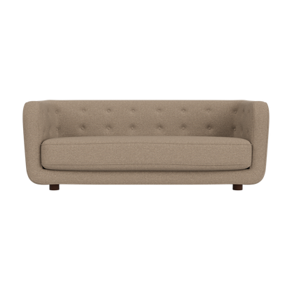 Vilhelm Sofa in Logan Flint fabric with a button-tufted backrest and dark-stained oak legs against a white background.