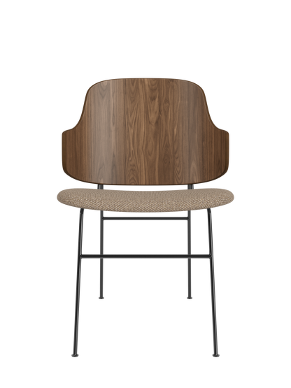 The Penguin Dining Chair with curved walnut veneer back, Logan Flint upholstered seat and slender black metal frame.