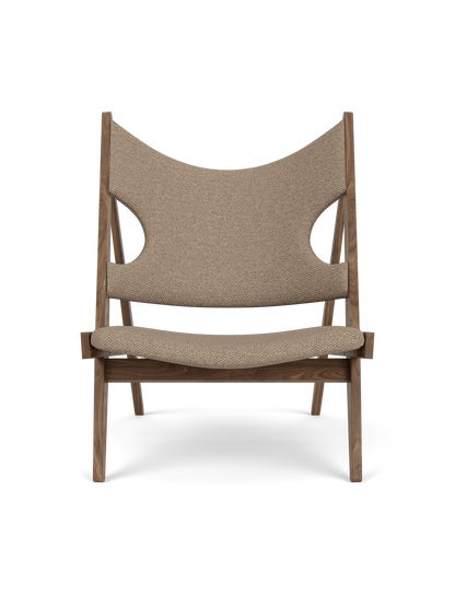 Front view of the Knitting Lounge Chair in walnut with light brown Logan Flint upholstery and its distinctive side cut-outs.