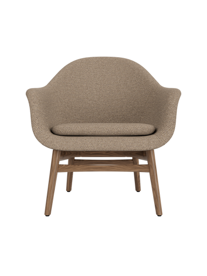 Harbour Lounge Chair in textured Logan Flint fabric with a solid walnut frame and minimalist, curved design.