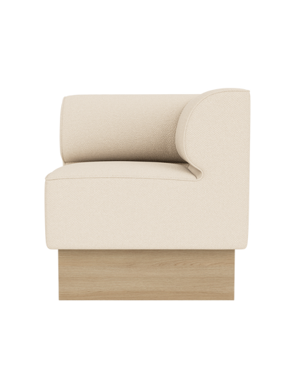 Eave Dining Sofa, Plateau in Logan Jasmine upholstery with a natural oak base, shown from a side angle.