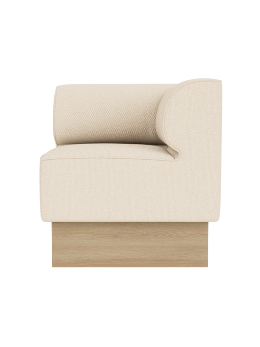 Eave Dining Sofa, Plateau in Logan Jasmine upholstery with a natural oak base, shown from a side angle.