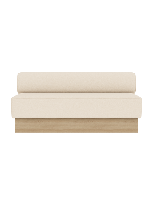 Eave Dining Sofa in Logan Jasmine upholstery with a natural oak base, shown from a front angle against a black background.