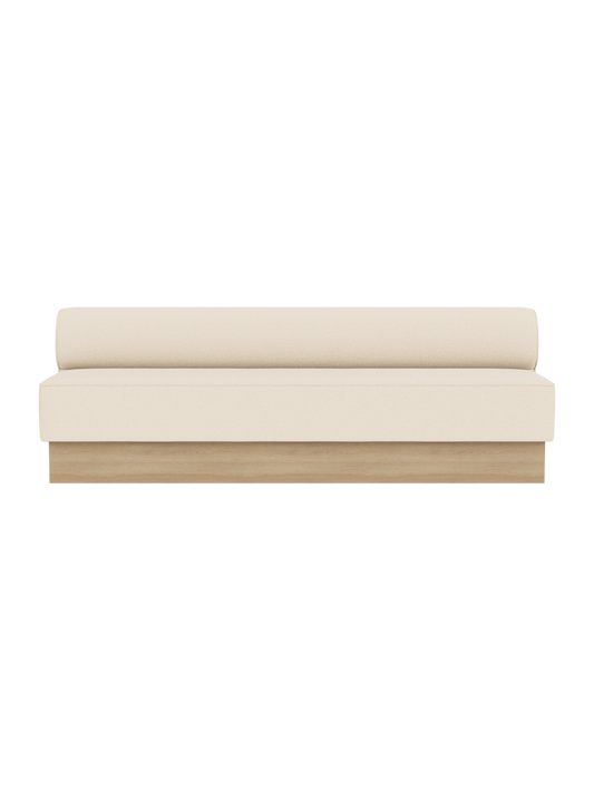 The Eave Dining Sofa, Plateau in Logan Jasmine upholstery with a natural oak base, shown from the front.