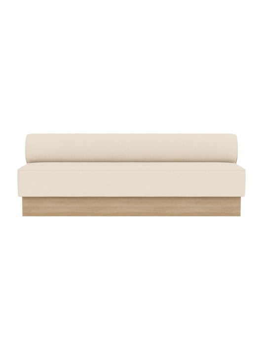 The Eave Dining Sofa, Plateau upholstered in Logan Jasmine fabric with a natural oak base, viewed from the front.