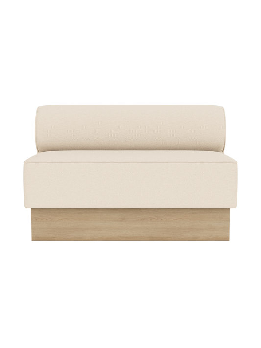 Eave Dining Sofa, Plateau in Logan Jasmine upholstery with a natural oak base, shown from the front.