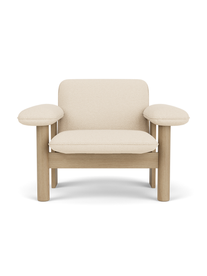 Front view of the Brasilia Lounge Chair, Low Back, with a natural oak frame and upholstered in light Logan Jasmine textile.