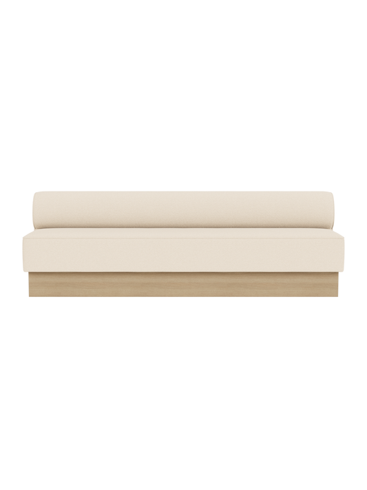 Eave Dining Sofa, Plateau in Logan Jasmine upholstery with a natural oak base, shown from a front angle.