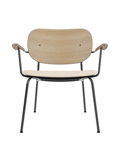 Co Lounge Chair with natural oak veneer backrest, Logan Jasmine upholstered seat, and a slim black steel frame.