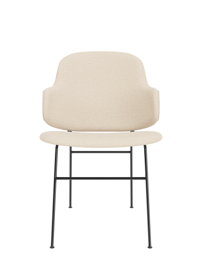 The Penguin Dining Chair in Logan Jasmine upholstery with a curved back and slender black powder-coated steel legs.