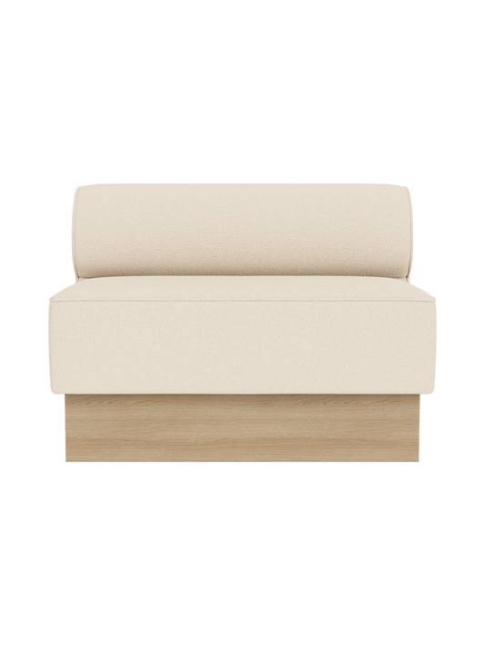 The Eave Dining Sofa, Plateau upholstered in Logan Jasmine fabric with a natural oak base, shown from a front view.