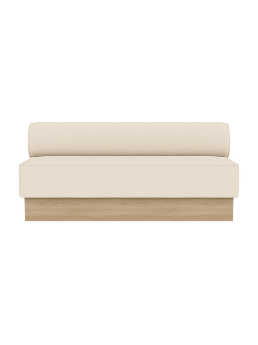 Eave Dining Sofa, Plateau upholstered in Logan Jasmine fabric with a natural oak base, shown from a front angle.