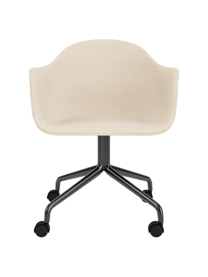 Harbour Dining Chair featuring Logan Jasmine upholstery and a black powder-coated star base with casters.