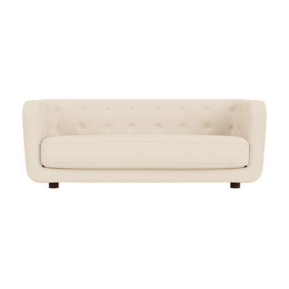 Vilhelm Sofa in Logan Jasmine cream fabric with a button-detailed back and dark smoked oak legs, front-facing view.