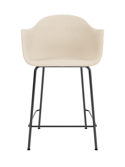 Harbour Counter Chair upholstered in Logan Jasmine fabric with a sculptural black powder-coated steel frame.