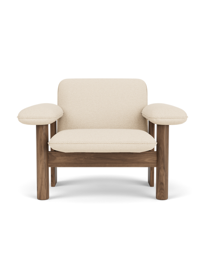 Front view of the Brasilia Lounge Chair with a low back, featuring a solid walnut frame and off-white Logan Jasmine textile.