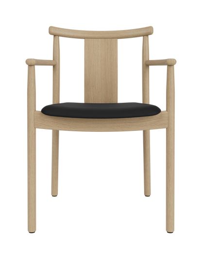 Merkur Dining Chair with Armrests in natural oak and black Sierra leather upholstery, shown from a front-facing angle.