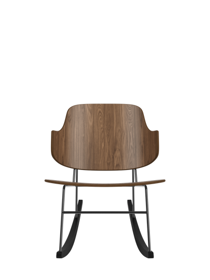 The Penguin Rocking Chair in walnut veneer with a black steel frame, featuring its signature sculptural silhouette.