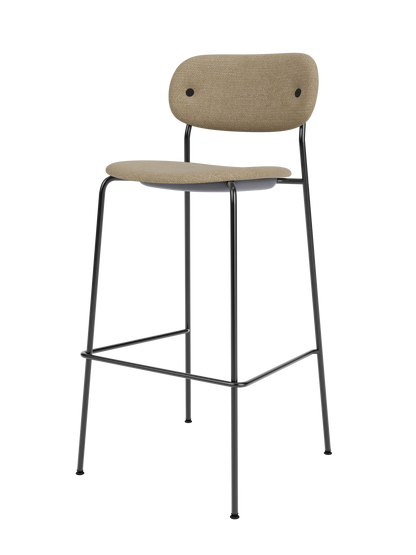 Fully upholstered Co Bar Chair featuring a slender black steel frame and textured beige bouclé fabric.