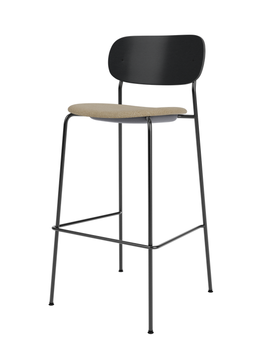 Co Bar Chair with a beige Bouclé 02 upholstered seat and black painted oak backrest on a slender black steel frame.