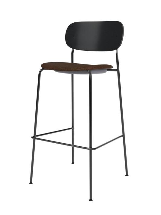 Co Bar Chair featuring a black painted oak back and brown bouclé upholstered seat on a slender black steel frame.