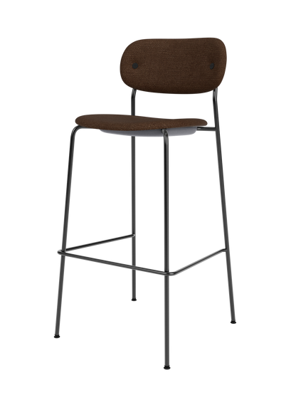 Co Bar Chair, Fully Upholstered in dark brown bouclé fabric with a slender black steel frame and footrest.