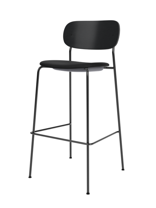 Black Co Bar Chair with an upholstered seat, black oak backrest and a slender black steel frame with footrest.