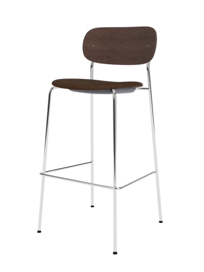 Co Bar Chair with a chrome frame, dark stained oak backrest and black bouclé upholstered seat.