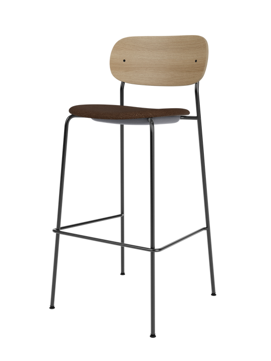 Co Bar Chair featuring a natural oak backrest and black bouclé upholstered seat on a slender black steel frame.