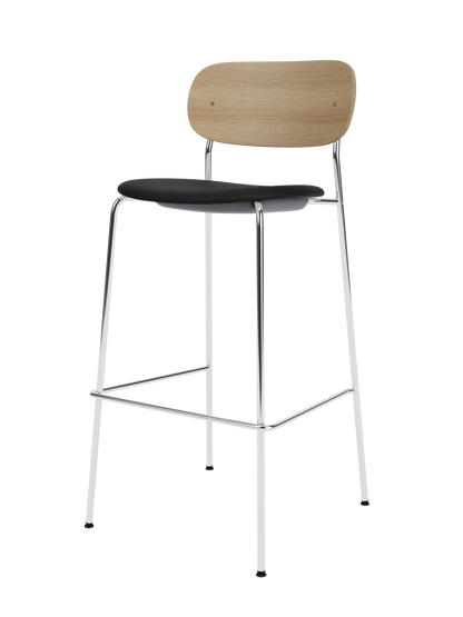 Co Bar Chair with a sleek chrome frame, natural oak wood backrest, and black leather upholstered seat.