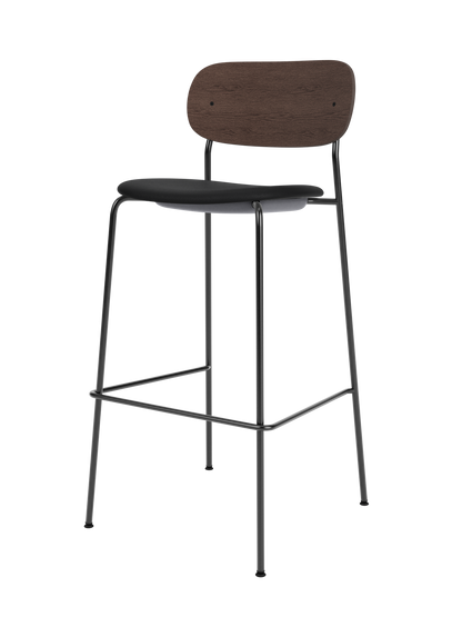 Co Bar Chair with a dark stained oak back, black upholstered seat and slender steel frame with a footrest.