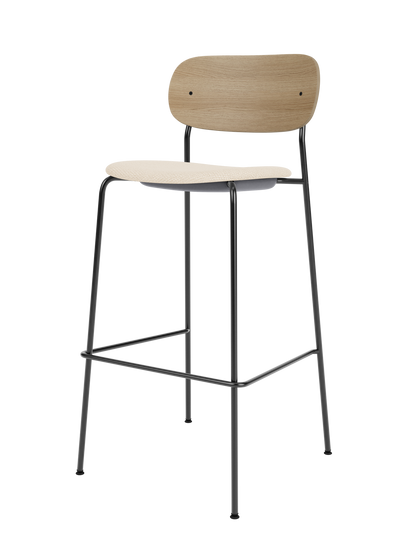 Co Bar Chair with natural oak backrest and Logan Jasmine upholstered seat, set on a slender black steel frame.