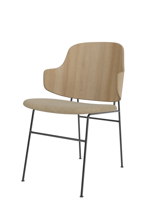 The Penguin Dining Chair with a natural oak back and Audo Bouclé 02 upholstered seat on a slender black steel frame.