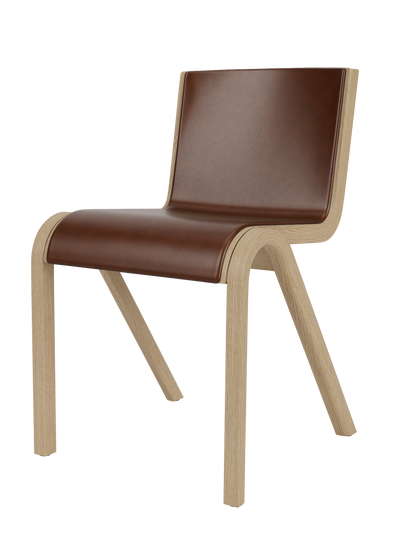 Ready Dining Chair in natural oak with brown leather upholstery, showcasing its sculptural, cantilevered design.