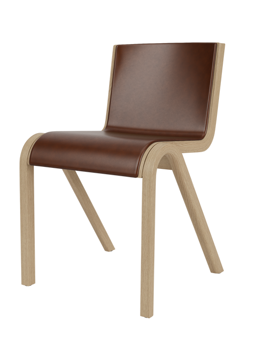 Ready Dining Chair in natural oak with brown leather upholstery, showcasing its sculptural, cantilevered design.