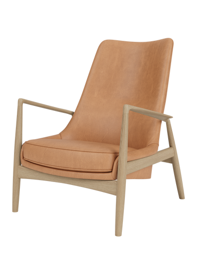 The Seal Lounge Chair, High Back in camel leather and natural oak, with an elegant, angled frame on a white background.