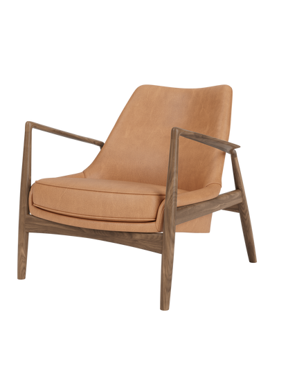 The Seal Lounge Chair, Low Back with an oiled walnut frame and Dunes Camel leather upholstery in an organic design.