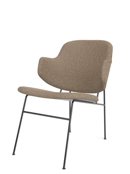 A three-quarter view of The Penguin Lounge Chair, fully upholstered in textured Logan Flint fabric with a slim dark frame.