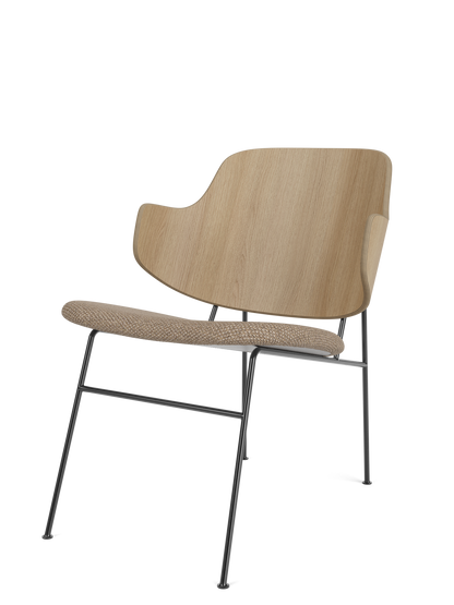 The Penguin Lounge Chair, shown at a three-quarter angle, with a natural oak backrest and a Logan Flint upholstered seat.