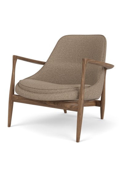 The Elizabeth Lounge Chair, featuring a dark walnut frame with sculpted armrests and Logan Flint upholstery.