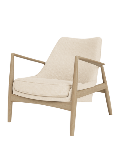 The Seal Lounge Chair, Low Back in natural oak with textured Logan Jasmine upholstery and angled armrests.