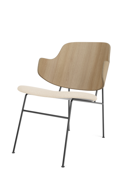 The Penguin Lounge Chair with a curved natural oak backrest, Logan Jasmine fabric seat, and thin black metal frame.
